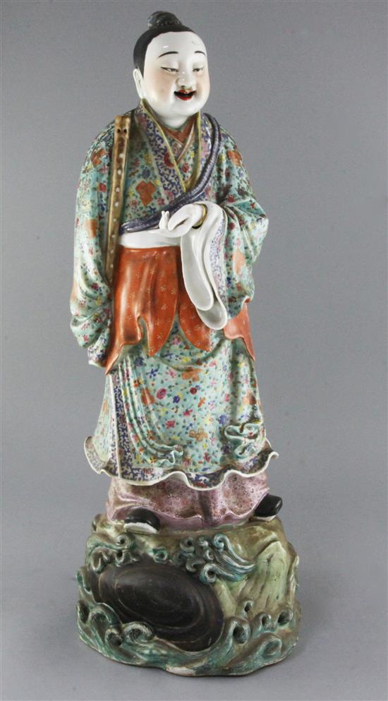 A large Chinese famille rose figure holding a flute, late 19th century